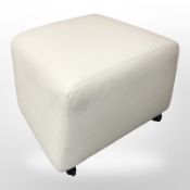 A contemporary stitched white leather footstool, width 57 cm.