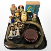 A group of Russian dolls, miniature copper and brass measures, opera glasses,