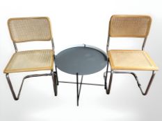 A pair of bergere chrome dining chairs together with a metal occasional table.