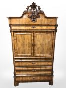 A 20th century continental mahogany double door drinks cabinet fitted drawers beneath,