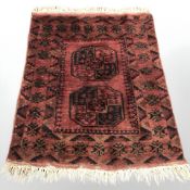 A Turkoman rug, 98 cm x 115 cm.