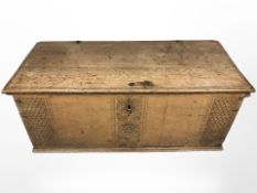 A 19th century oak carved blanket box,