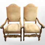 A pair continental oak scroll arm armchairs, width 65 cm.