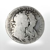 A silver William and Mary coin, 1689.