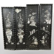 Four Japanese lacquered and mother of pearl inlaid rectangular panels, each 63 cm x 17 cm.