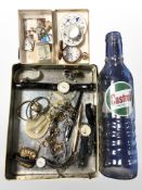 A tin of mixed costume jewellery, gold plated half hunter pocket watch, miniature teacup and saucer,