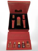 Boxed group of five perfumes and a further Elizabeth Arden Red Door cosmetic gift set.