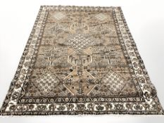 An Afghan carpet of geometric design, 285 cm x 200 cm.