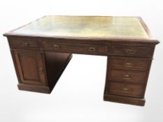 A Victorian oak pedestal partner's desk,