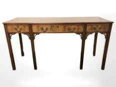 A Chippendale style mahogany side table, fitted with three drawers,