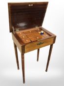 A 19th century inlaid mahogany sewing table with lift up lid, width 52 cm.