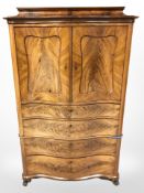 A 19th century mahogany serpentine fronted cabinet fitted with four drawers, width 106 cm.