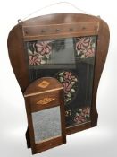 An inlaid mahogany framed needlework picture and a similar mirror, largest 92 cm high.