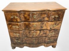 A stained beechwood serpentine fronted four drawer chest, width 120 cm.