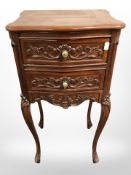 A reproduction French style two drawer bedside stand, height 73 cm.