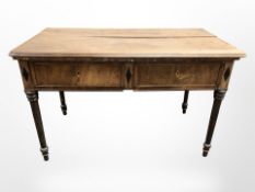A 19th century mahogany two drawer side table (as found), 135 cm x 74 cm x 84 cm.