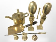 A pair of brass fire dogs, watering can, weights,