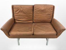 A mid-century two seater settee on chrome legs, width 137 cm.