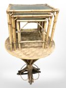 A bamboo occasional table together with a nest of three tables.