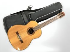 A Japanese acoustic guitar with carry bag.