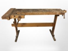A wooden workbench fitted with vice, width 140 cm.