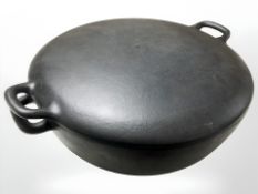 A Danish Copco cast iron twin handled cooking pot with lid, diameter 34 cm.
