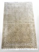 An Indian silk piled rug, 163 cm x 103 cm.