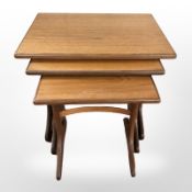 A nest of teak G Plan tables, width 56 cm.