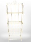 A painted wrought metal open bookcase, width 66 cm.