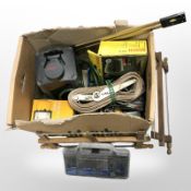 A group of hand saws, ratchet straps,