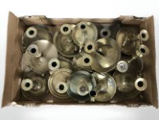 A group of brass chamber sticks.