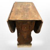 A 19th century oak gate leg table,
