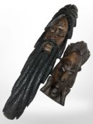 Two African carved hardwood masks, largest 69 cm.