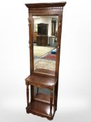 A reproduction mahogany mirror back hall stand, width 60 cm.
