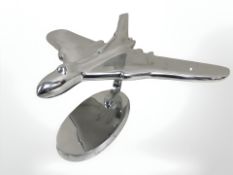 An aluminium model Vulcan bomber on stand.