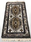 A Caucasian rug, 153 cm x 83 cm.