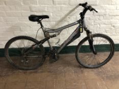 An Apollo FS 26 full suspension mountain bike