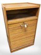 A 20th century oak tambour front pedestal chest, with key, 46 cm x 34 cm x 75 cm.
