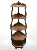 A reproduction mahogany corner whatnot, width 50 cm.