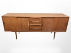 A 20th century teak and pine sliding door low sideboard, 190 cm x 48 cm x 80 cm.