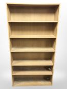A light oak adjustable bookcase,