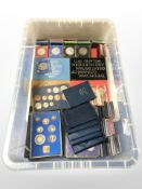 A large quantity of British decimal coin sets, crowns, etc.