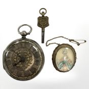 A silver fob watch and a pendant/brooch in gilt frame.