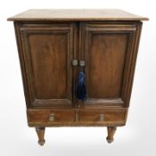 A small double door mahogany cabinet, width 43 cm.