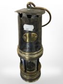 A 19th century steel and brass miner's lamp,