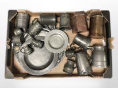 A group of pewter tankards, plaques,
