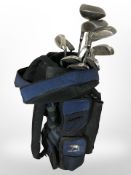A golf bag containing a quantity of clubs including Arnold Palmer Deacon drivers,