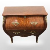 A continental inlaid bombe two drawer chest with ormolu mounts,