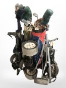 A quantity of golf bags, clubs, part golf trolleys, etc.