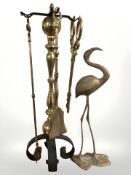 A brass and wrought iron companion set and a brass figure of a flamingo.